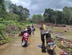 Bhabinkamtibmas Desa Menunuk Ingatkan Warga Agar Waspada Banjir