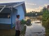 Debit Air Naik, Kapolsek Menukung Himbau Warga Waspada Banjir